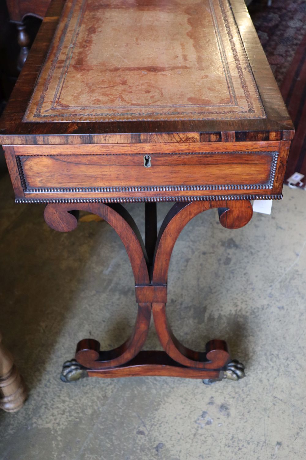 A Regency rosewood writing table, fitted end drawer, width 77cm depth 44cm height 73cm